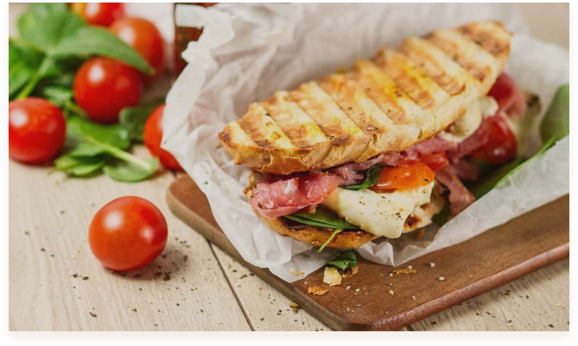 <b> Panini - $9.00</b> Grilled sandwiches with assorted fillings, served with a side salad.