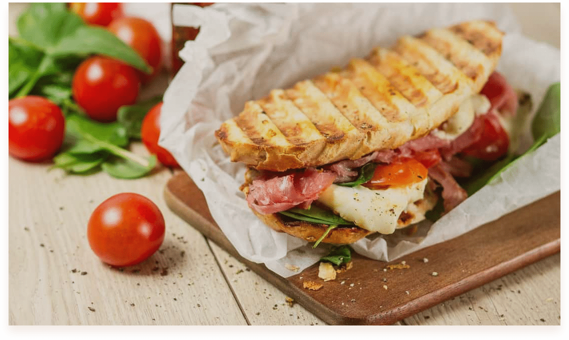 <b> Panini - $9.00</b> Grilled sandwiches with assorted fillings, served with a side salad.